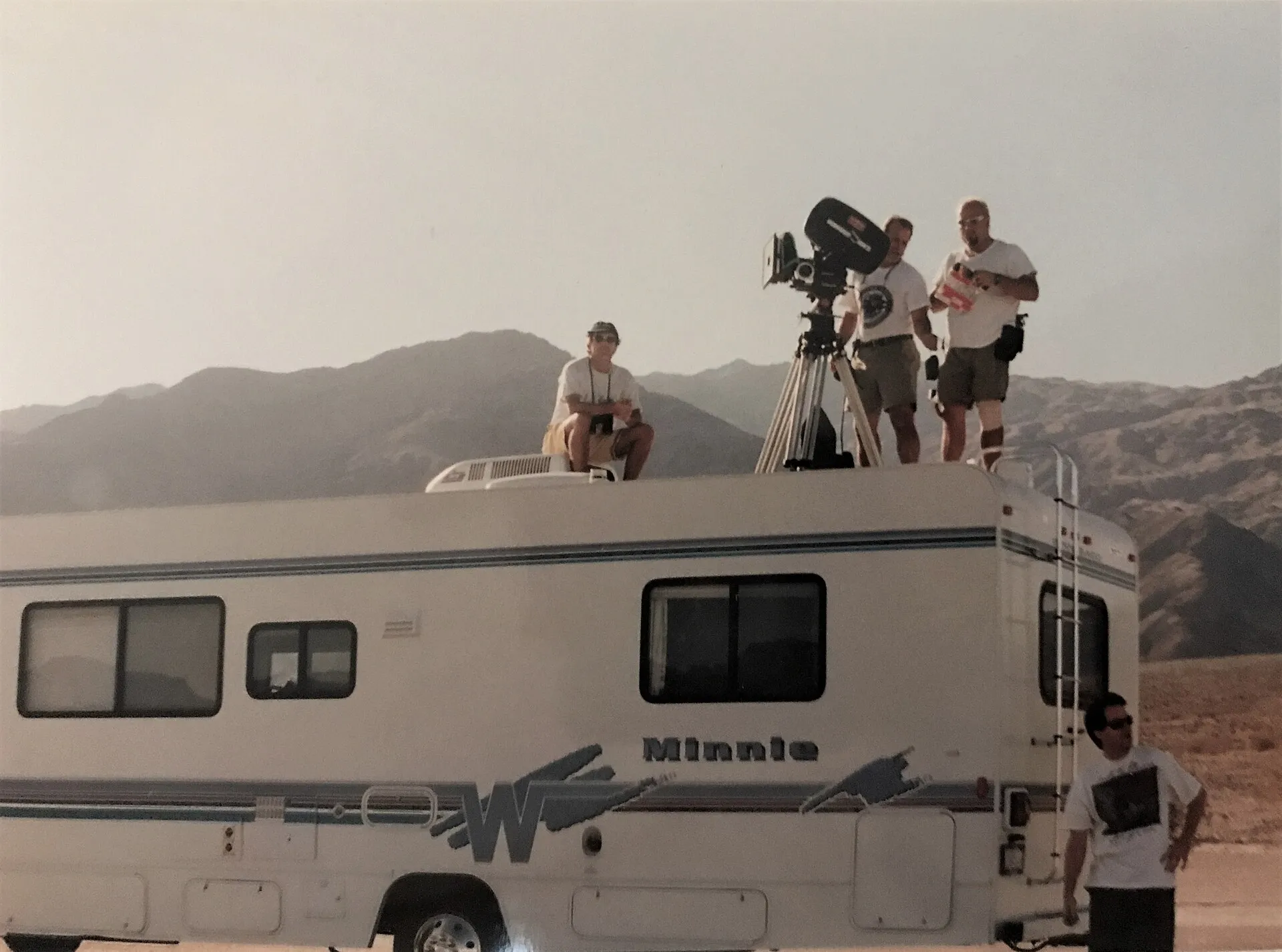 film director on set with camera crew