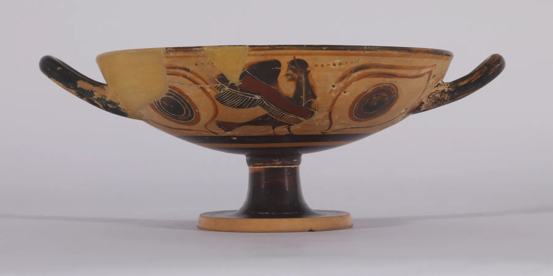 ancient Greek pottery depicting mythological figures